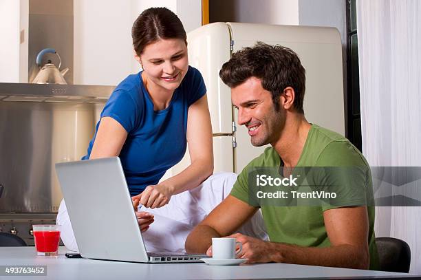 Couple Having Breakfast In The Kitchen Stock Photo - Download Image Now - 2015, Adult, Adults Only