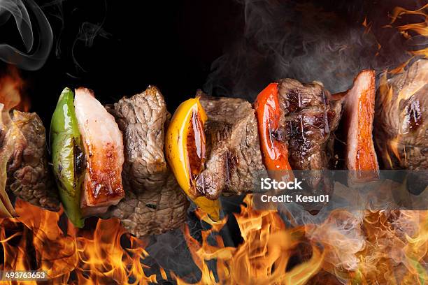 Tasty Skewers On Black Background Stock Photo - Download Image Now - Backgrounds, Barbecue - Meal, Barbecue Grill