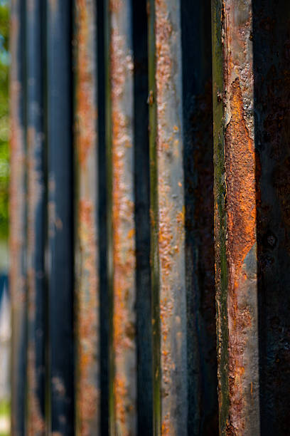 istock Rusty steel tubing with peeling paint oxidizing metal patterns a 493763680