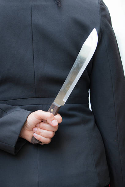istock Business woman holding knife 493764075