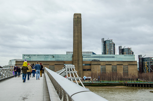 London, United Kingdom - February 18, 2012: The Tate modern museum stands on the Thames river shore in London, UK. The Tate Modern is one of the most famous contemporary art galleries in the world.