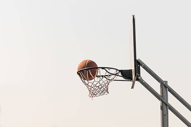 istock ball into the basketball net 493765690