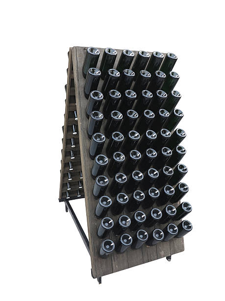 istock Dark bottles on a wine cellar wooden support isolated 493765726