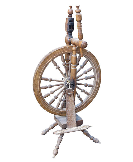 istock Old Wooden spinning Wheel isolated on white 493765996