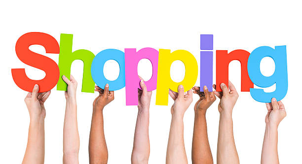 istock Multiethnic Arms Raised Holding Text Shopping 493766773