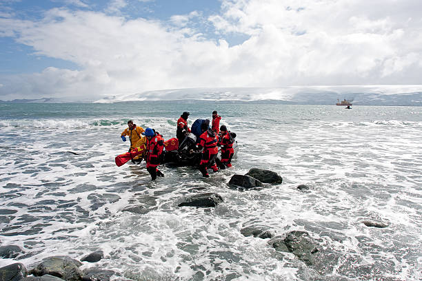 Boat with scientists arriving on Antarctica Livingston Island, Antarctica, January 15, 2012  scientific exploration stock pictures, royalty-free photos & images