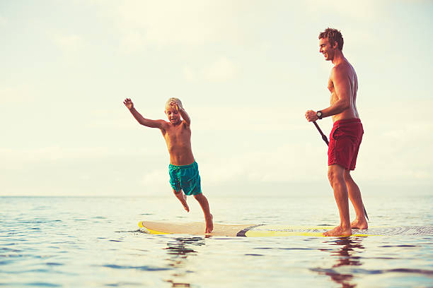 istock Father and Son Stand Up Paddling 493768088