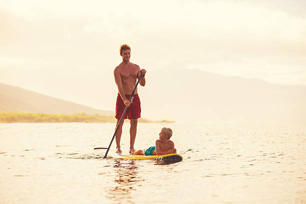 istock Father and Son Stand Up Paddling 493768116