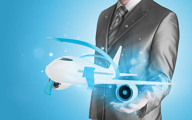 istock Businessman with airplane over his hand 493768925