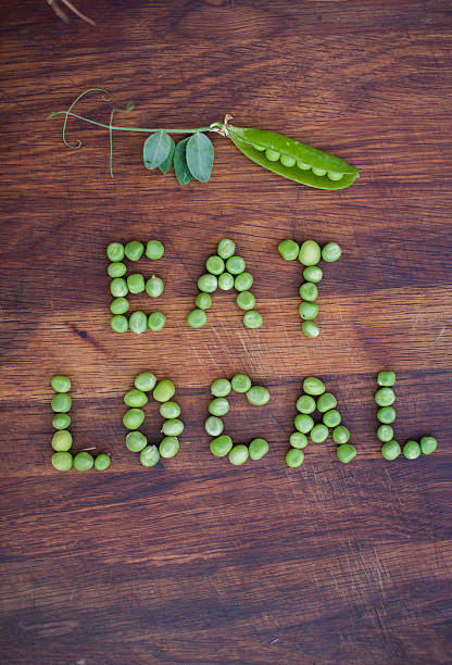 "Eat Local" phrase made of green peas