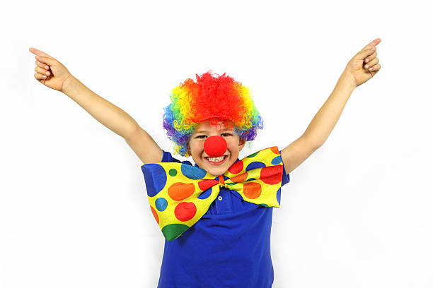 istock Happy Child Dressed up as Clown With Arms Outstretched 493770464