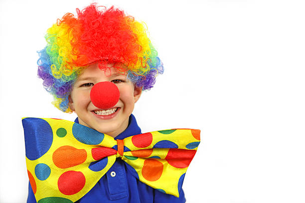 istock Child with Clown Wig and Jumbo Tie on White Background 493770574
