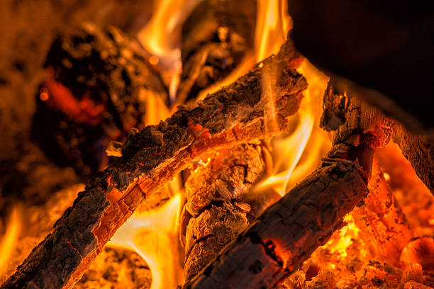 istock wood embers detail in fire place 493770630