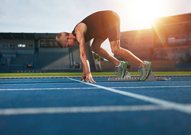istock Young man on starting position about to run 493771898
