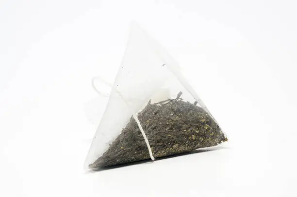 Bags of greentea on a white background