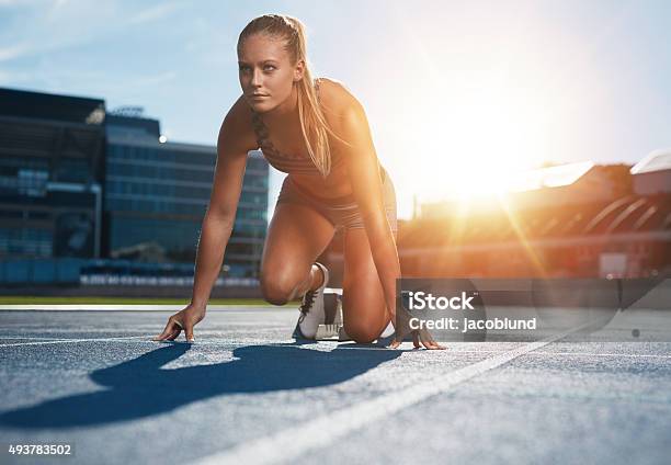 Running With Determination Stock Photo - Download Image Now - Sprinting, Women, Running Track