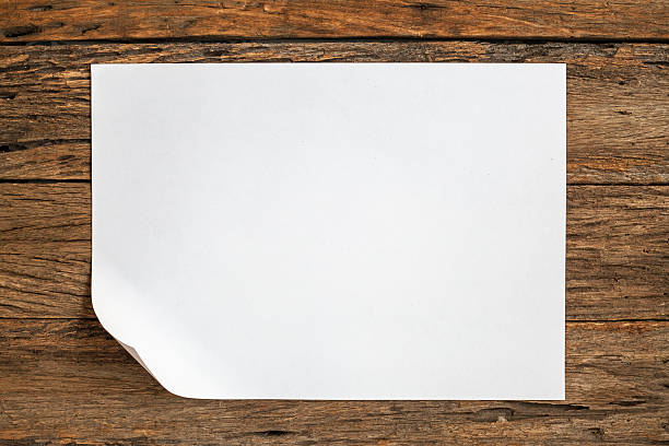 istock Crumpled paper on wooden background 493784948