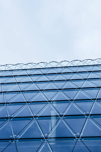 istock Modern glass architecture on new office building with blue windows 493788514
