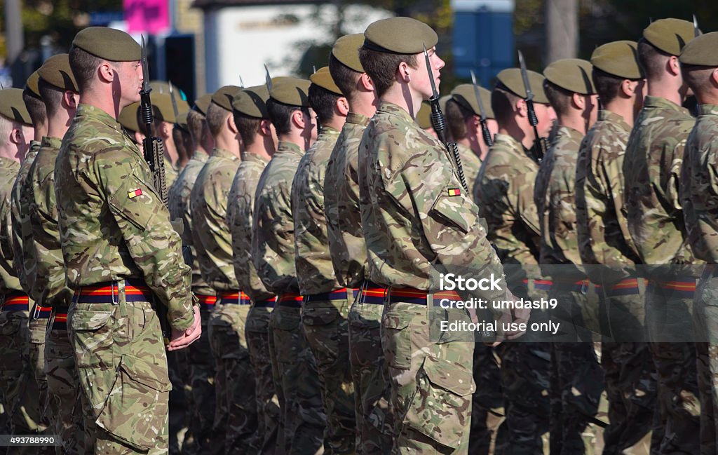 Soldiers of the Royal Anglian Regiment St Neots, Cambridgeshire, England - October 20, 2015: Soldiers of the Royal Anglian Regiment on Parade. in three ranks with arms British Culture Stock Photo