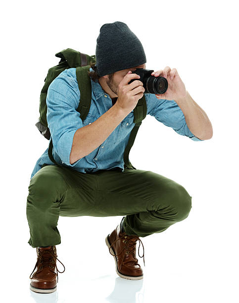 istock Male photographer in action 493789306