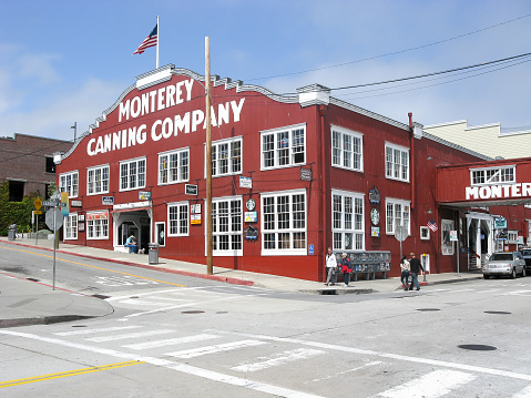 Monterey, California, USA - April 26, 2013: Street scene of Cannery Row with Monterey Sardines Canning Company in California