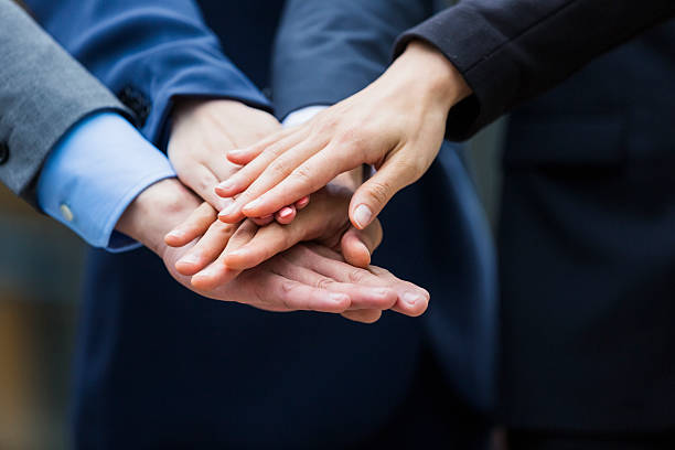 istock Business-team holding hands on top of each other 493795657