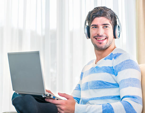 istock Young man enjoying music 493795677