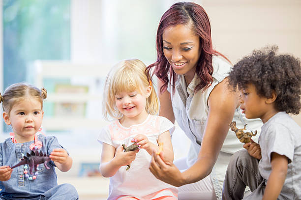 istock Children Playing with Toy Animals 493796896