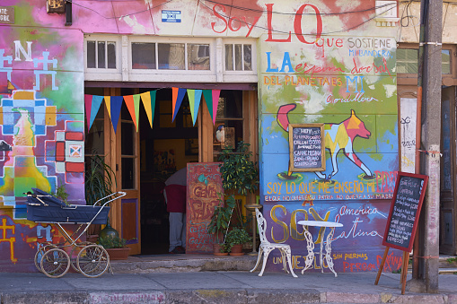 Valparaiso, Сhile - May 16, 2014: Colourful murals decorating a cafe in the UNESCO world heritage city of Valparaiso in Chile. Valparaiso is renowned for the number and quality of the murals decorating streets and buildings around the city.