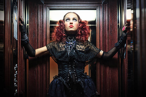 Witch in elevator . Halloween theme Portrait In The Dark .Witch in elevator .Halloween theme gothic girl stock pictures, royalty-free photos & images