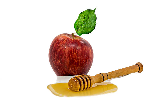 istock Apple and honey isolated on white 493800463