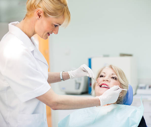 istock Old woman patient and dentist 493800703