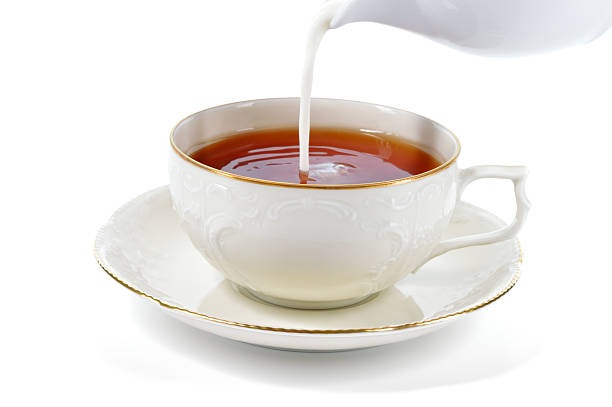 istock Serving cup of tea with milk. 493800927