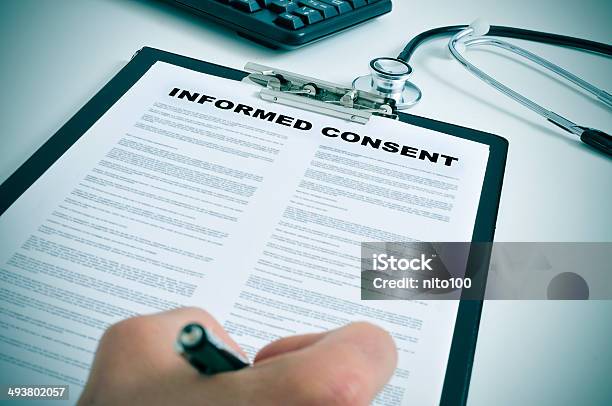 Signing An Informed Consent Stock Photo - Download Image Now - Permission - Concept, Patient, Healthcare And Medicine