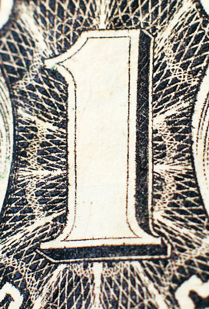 istock Part of one dollar closeup vertical position 493802139