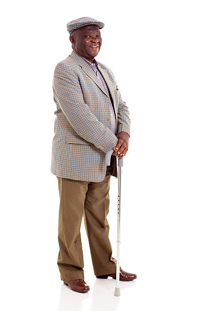 istock elderly african man holding walking cane 493802757