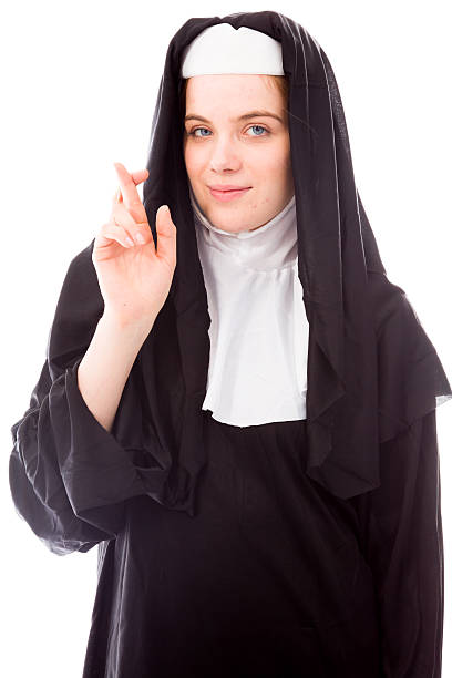 istock Young nun wishing with crossing fingers 493803039