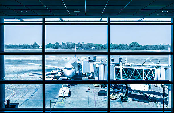 istock Modern airport with airplane at the terminal gate 493803343