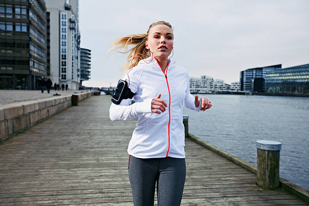 istock Young woman out for a jog 493829987