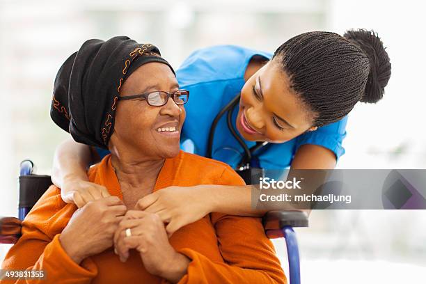 African Senior Patient With Female Nurse Stock Photo - Download Image Now - Community Outreach, Senior Adult, African Ethnicity