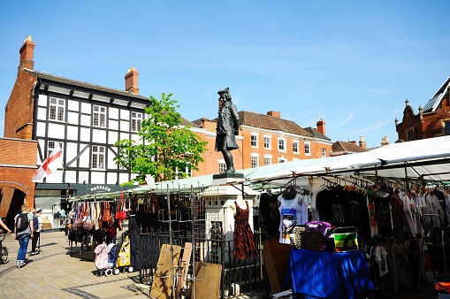 Lichfield, United Kingdom - May 3, 2014:  The popular Saturday market in the Market Place with a statue of James Boswell in the centre, Lichfield, Staffordshire, England, United Kingdom, Western Europe.