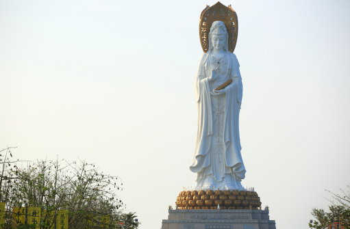 Sanya, Сhina - March 26, 2014: goddess of  mercy statue at seaside in nanshan temple, hainan island ,nanshan temple is a  famous tourist destination in sanya,hainan province,china.