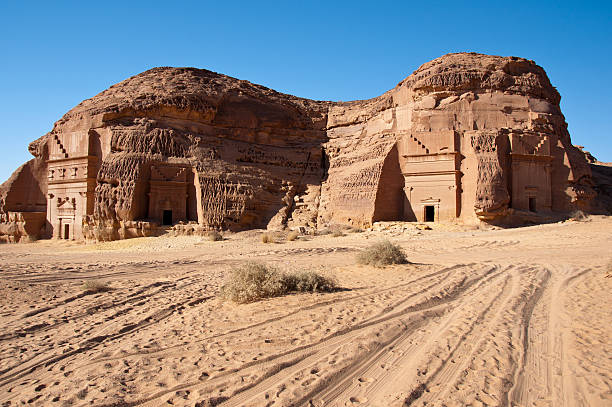 Al Hijr archaeological site Madain Saleh in Saudi Arabia tombs and landscape in Al-Hijr Al Hijr archaeological site Madain Saleh in Saudi Arabia al madinah photos stock pictures, royalty-free photos & images