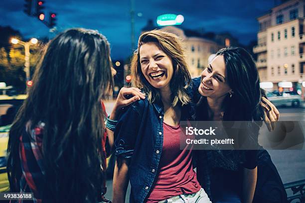 Smiling Woman Outdoors At Night Stock Photo - Download Image Now - Night, City, Laughing