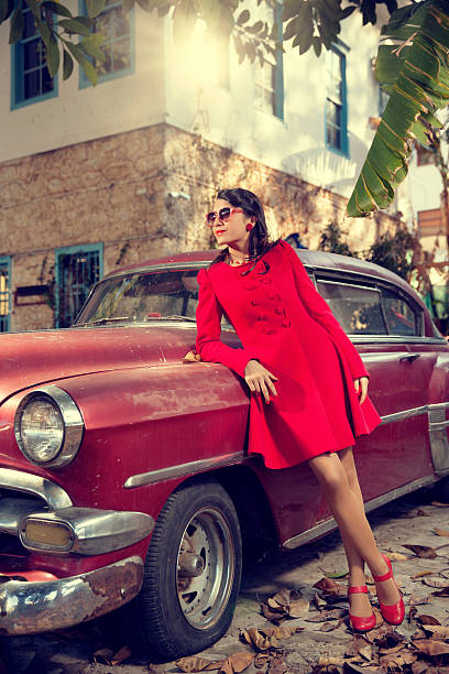 istock Retro young woman with vintage car 493836723