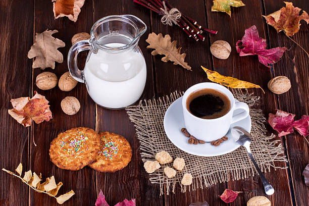 istock Coffee cup, cream, coffee grains and oatmeal cookies 493838246