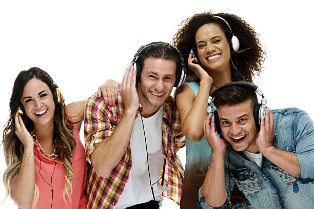 istock Smiling four friends listening music 493838788