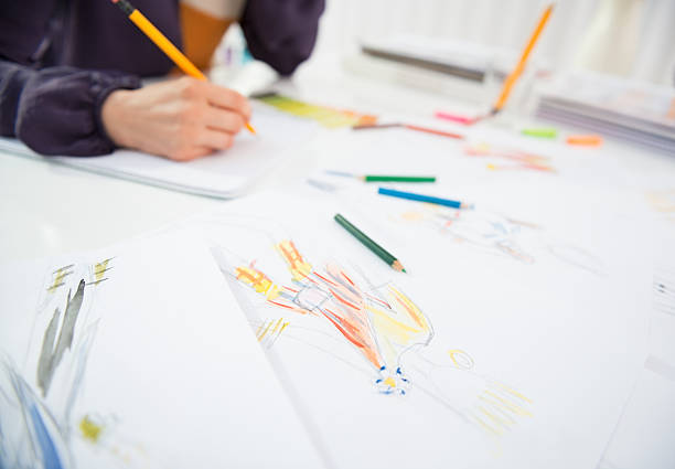 istock closeup on fashion designer making sketches 493849383