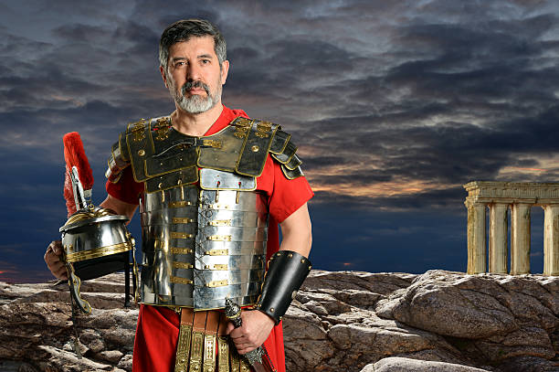 Centurion with Metal Armor Portrait of Roman Centurion outdoors in front of rocks roman centurion stock pictures, royalty-free photos & images