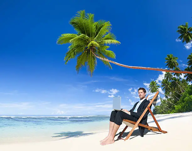 Photo of Businessman Working on his Vacation